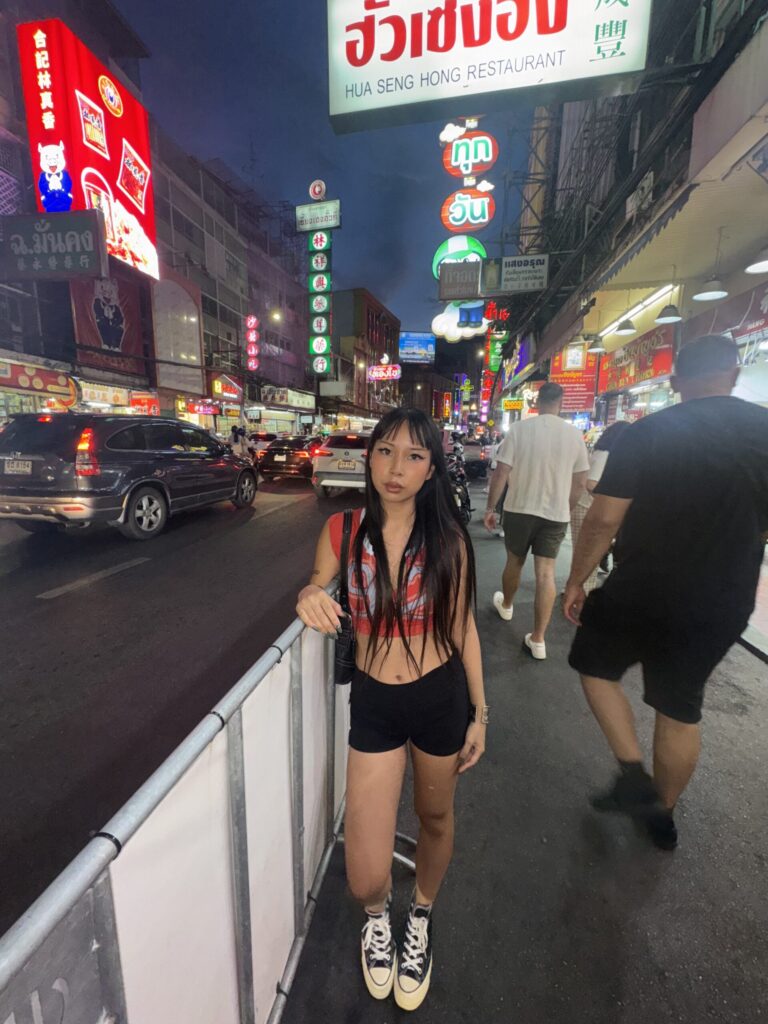 Street scene in Thailand showing local transport and vibrant atmosphere