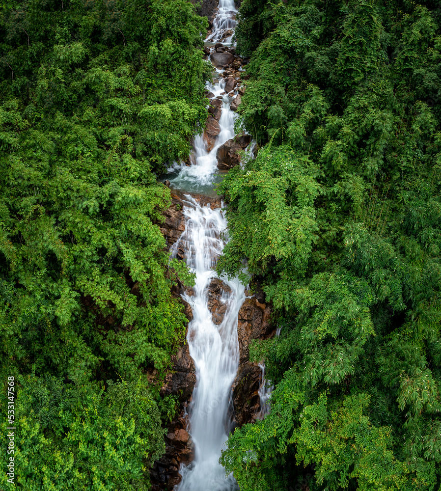 Stunning waterfall in Thailand during the rainy season with lush greenery